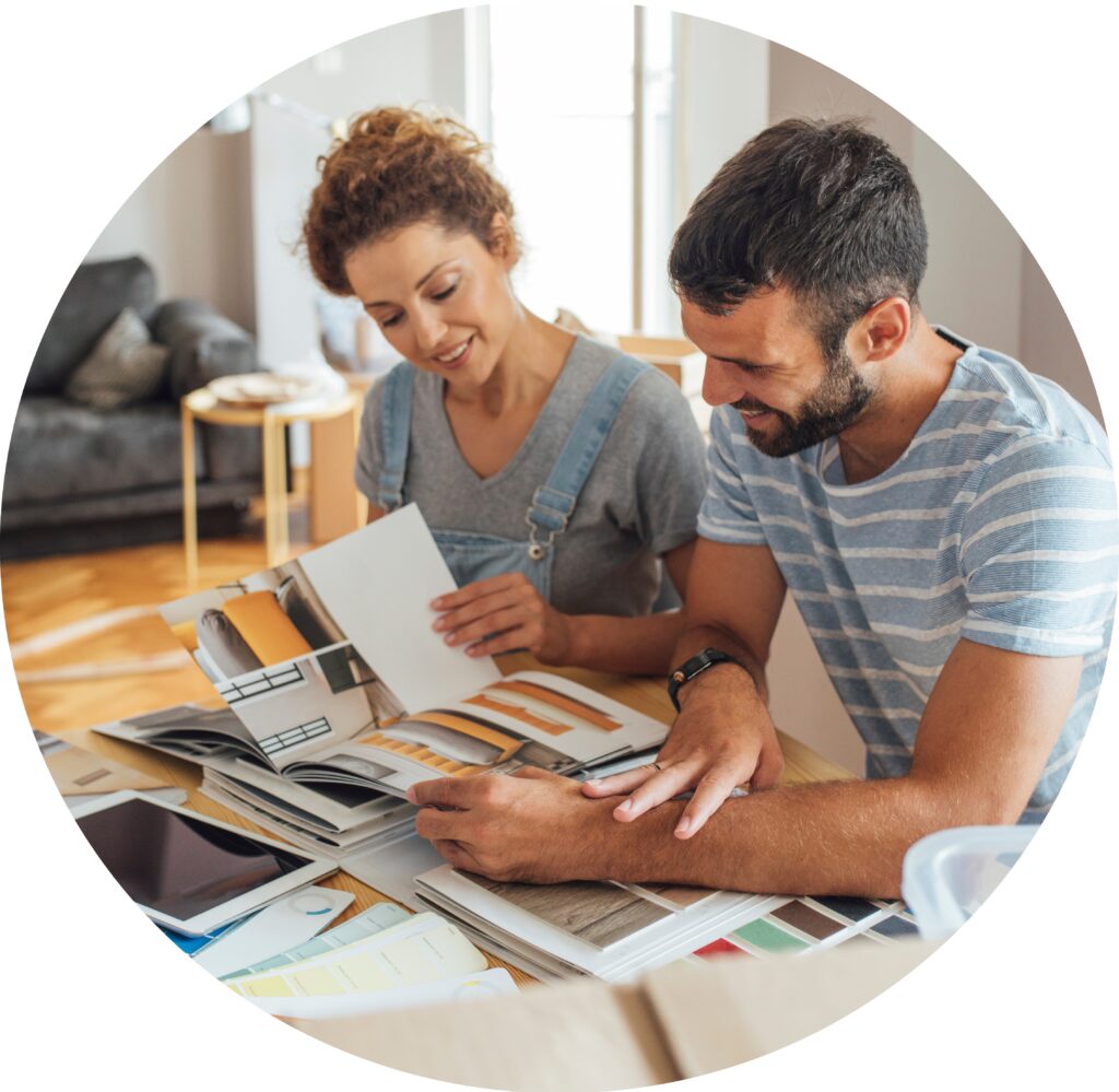 Couple Looking at Books for Remodeling Ideas