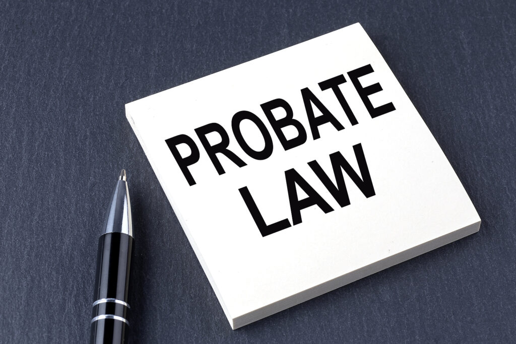 PROBATE LAW text on sticker with pen on the black background