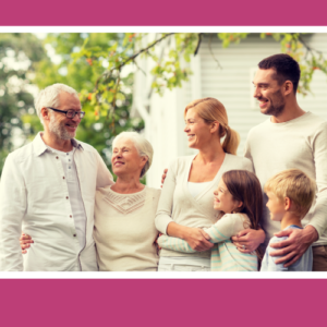 3 generations of a family all dressed in white, smiling and hugging each other