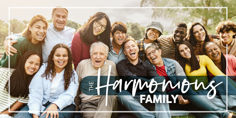 Group shot of multi-generational family smiling and laughing