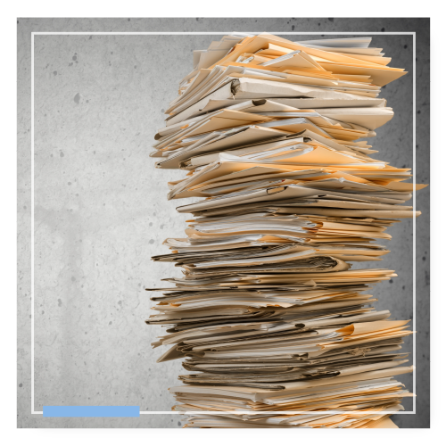 large stack of file folders stuffed with paperwork