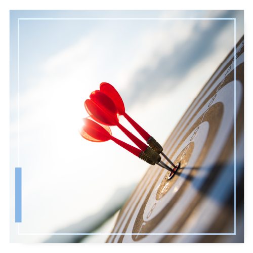 3 darts all sticking in the bullseye in a target