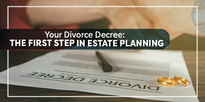 Divorce papers on a table with rings and a pen sitting on top