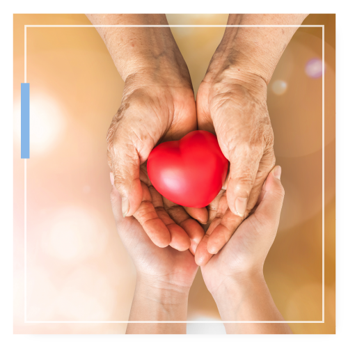 Young hands cupping elder hands holding a squishy heart - symbolizing caring