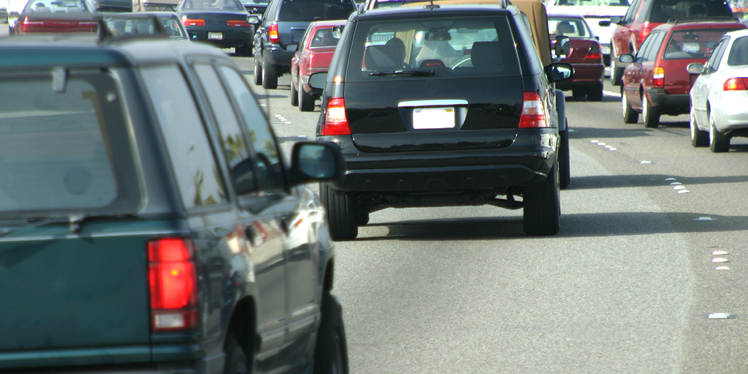 Cars driving in traffic - signifies the efficiency of estate planning via zoom
